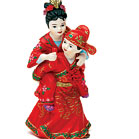 Cute Asian Couple in Traditional Wedding Attire made of hand painted porcelain. A caketop with a lot of character!