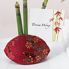 This oriental Snap Purse is traditionally used for jewelry or coins but also makes an amazing container for your truffles, mints or candies. With its snap closure it also works well as a place card holder. Satin brocade.